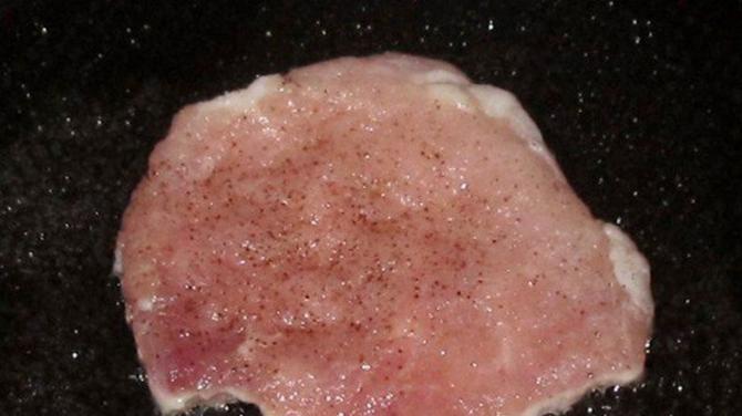 Pork escalope in a frying pan